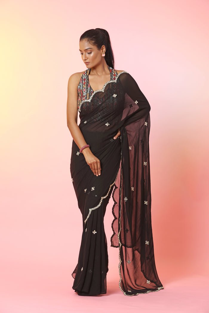 Buy beautiful black mirror work saree online in USA with halter neck blouse. Look your best at weddings and parties in Indian dresses, designer lehengas, Anarkali suits, designer gowns, salwar suits, sharara suits, embroidered sarees, designer sarees from Pure Elegance Indian fashion store in USA.-full view