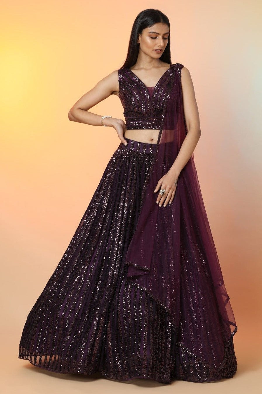 Buy wine color embellished designer lehenga online in USA with dupatta. Radiate glamor on special occasions in exquisite designer lehengas, Anarkali suits, wedding gowns, partywear saris, Bollywood sarees, fancy sarees from from Pure Elegance Indian saree store in USA.-full view