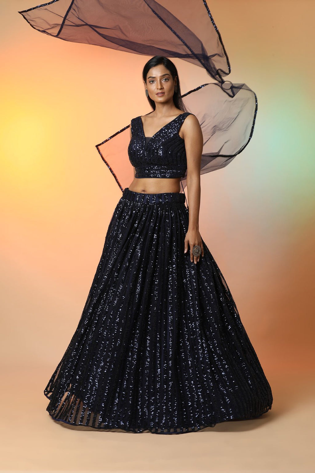 Buy midnight blue embellished designer lehenga online in USA with dupatta. Radiate glamor on special occasions in exquisite designer lehengas, Anarkali suits, wedding gowns, partywear saris, Bollywood sarees, fancy sarees from from Pure Elegance Indian saree store in USA.-full view