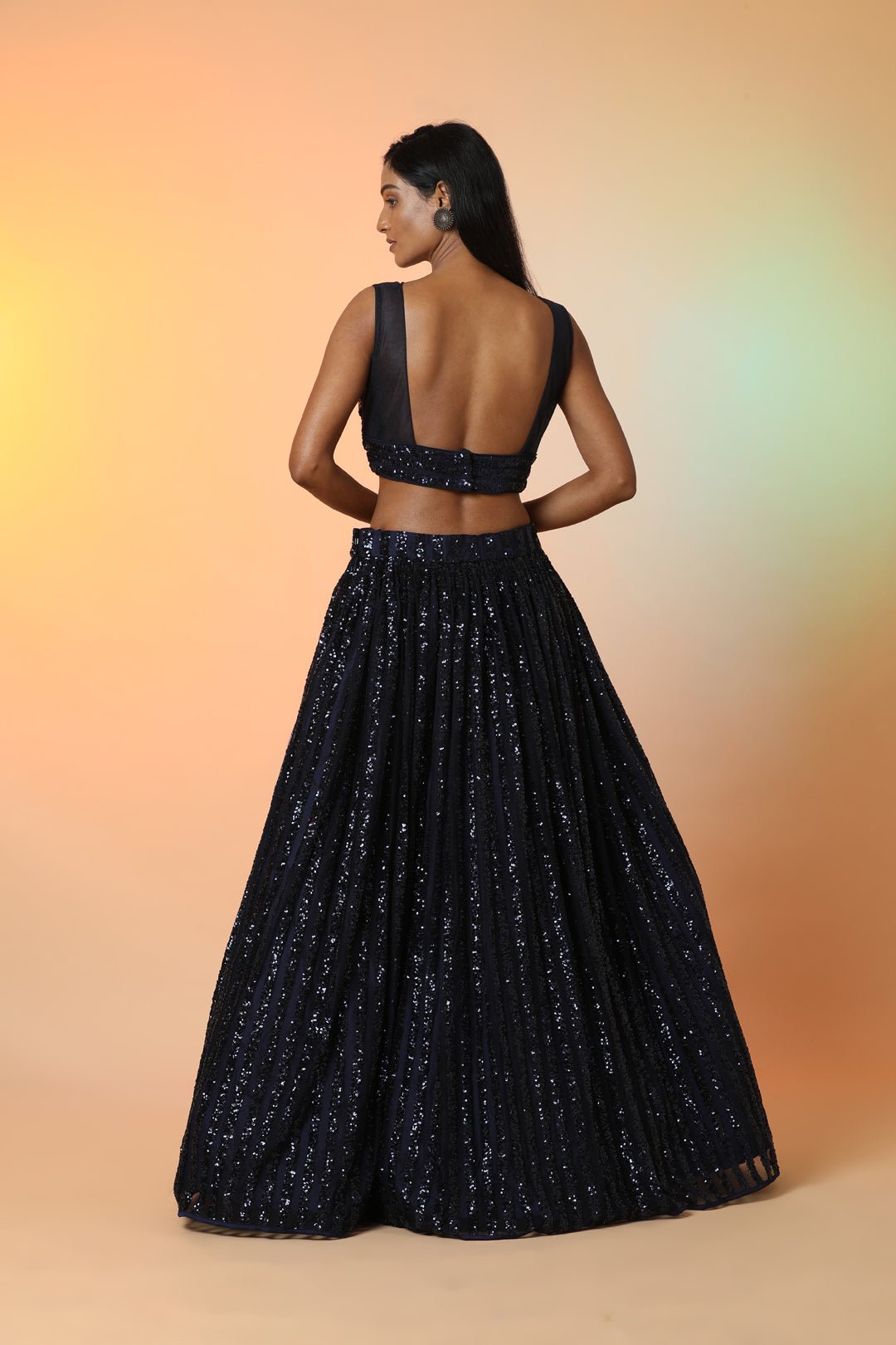 Buy midnight blue embellished designer lehenga online in USA with dupatta. Radiate glamor on special occasions in exquisite designer lehengas, Anarkali suits, wedding gowns, partywear saris, Bollywood sarees, fancy sarees from from Pure Elegance Indian saree store in USA.-back