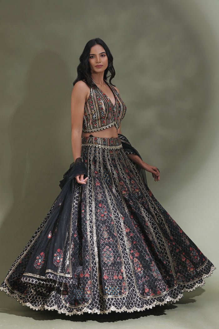 Shop black halter neck designer lehenga online in USA with dupatta. Look your best at weddings and parties in Indian dresses, designer lehengas, Anarkali suits, designer gowns, salwar suits, sharara suits from Pure Elegance Indian fashion store in USA.-side