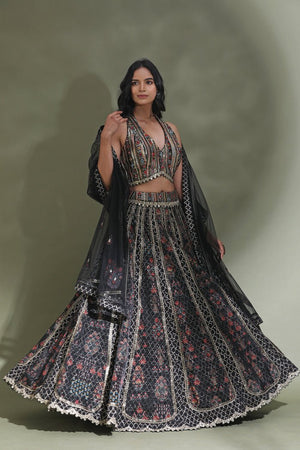 Shop black halter neck designer lehenga online in USA with dupatta. Look your best at weddings and parties in Indian dresses, designer lehengas, Anarkali suits, designer gowns, salwar suits, sharara suits from Pure Elegance Indian fashion store in USA.-lehenga