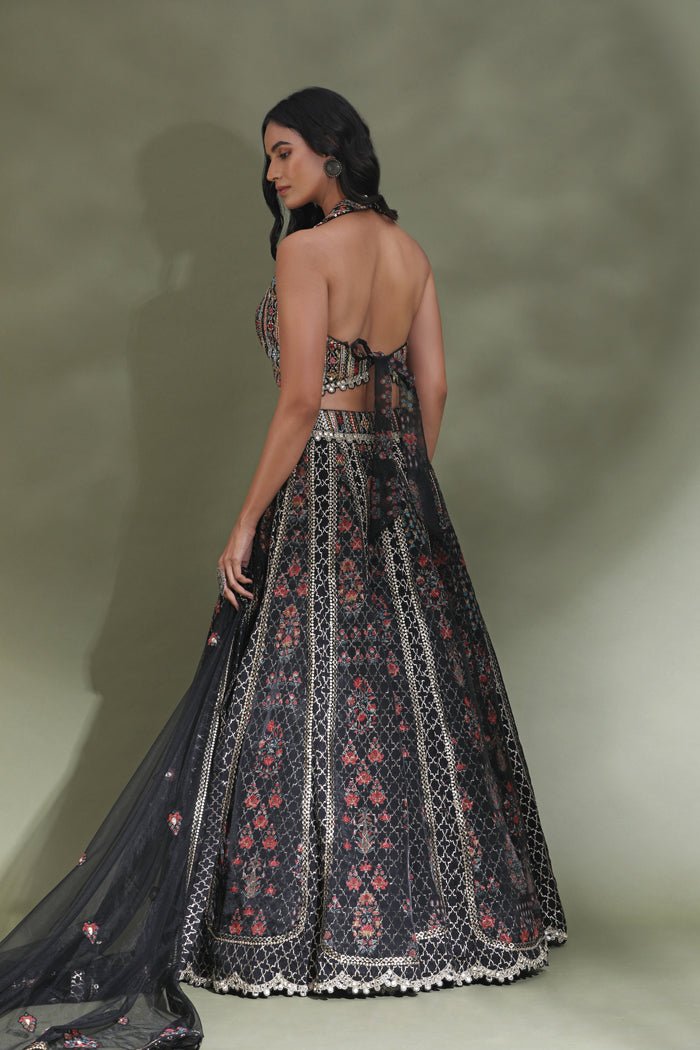 Shop black halter neck designer lehenga online in USA with dupatta. Look your best at weddings and parties in Indian dresses, designer lehengas, Anarkali suits, designer gowns, salwar suits, sharara suits from Pure Elegance Indian fashion store in USA.-back