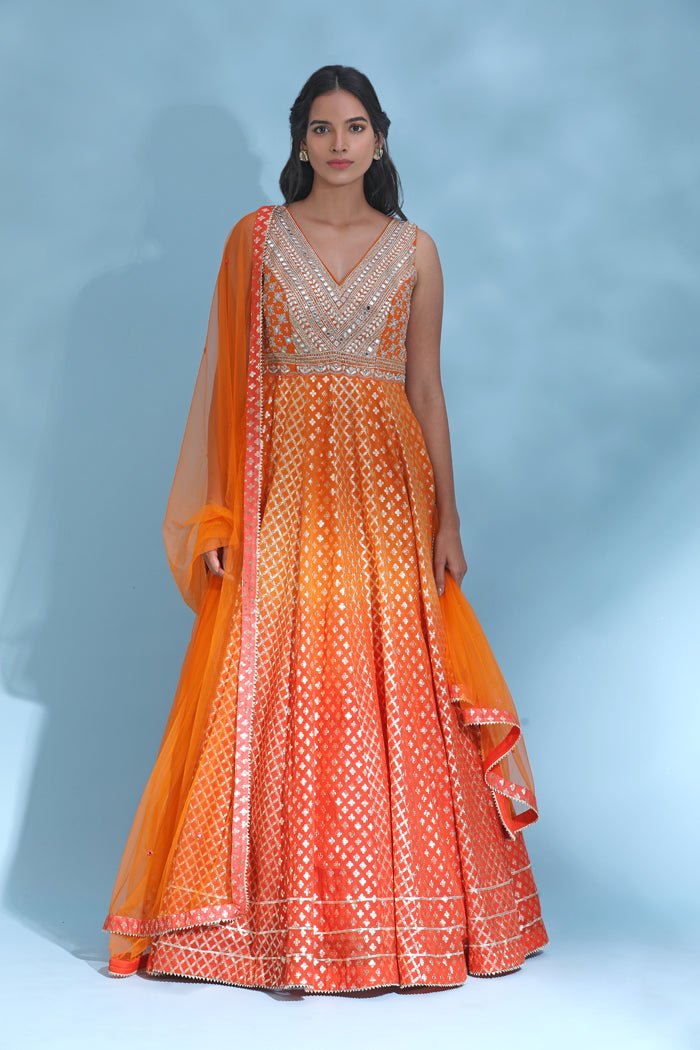 Shop stunning orange mirror work Anarkali online in USA with dupatta. Look your best at weddings and parties in Indian dresses, designer lehengas, Anarkali suits, designer gowns, salwar suits, sharara suits from Pure Elegance Indian fashion store in USA.-full view