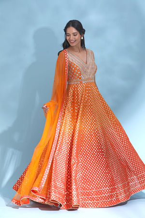 Shop stunning orange mirror work Anarkali online in USA with dupatta. Look your best at weddings and parties in Indian dresses, designer lehengas, Anarkali suits, designer gowns, salwar suits, sharara suits from Pure Elegance Indian fashion store in USA.-suit