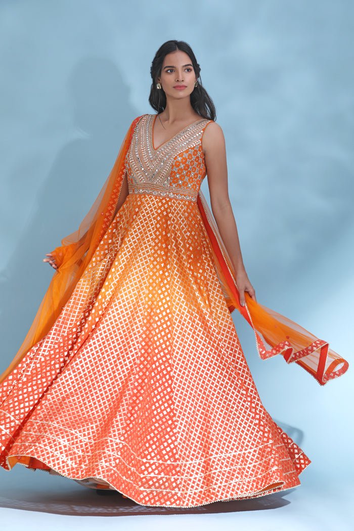 Shop stunning orange mirror work Anarkali online in USA with dupatta. Look your best at weddings and parties in Indian dresses, designer lehengas, Anarkali suits, designer gowns, salwar suits, sharara suits from Pure Elegance Indian fashion store in USA.-side