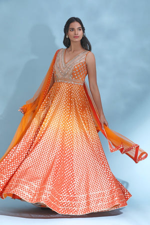 Shop stunning orange mirror work Anarkali online in USA with dupatta. Look your best at weddings and parties in Indian dresses, designer lehengas, Anarkali suits, designer gowns, salwar suits, sharara suits from Pure Elegance Indian fashion store in USA.-side