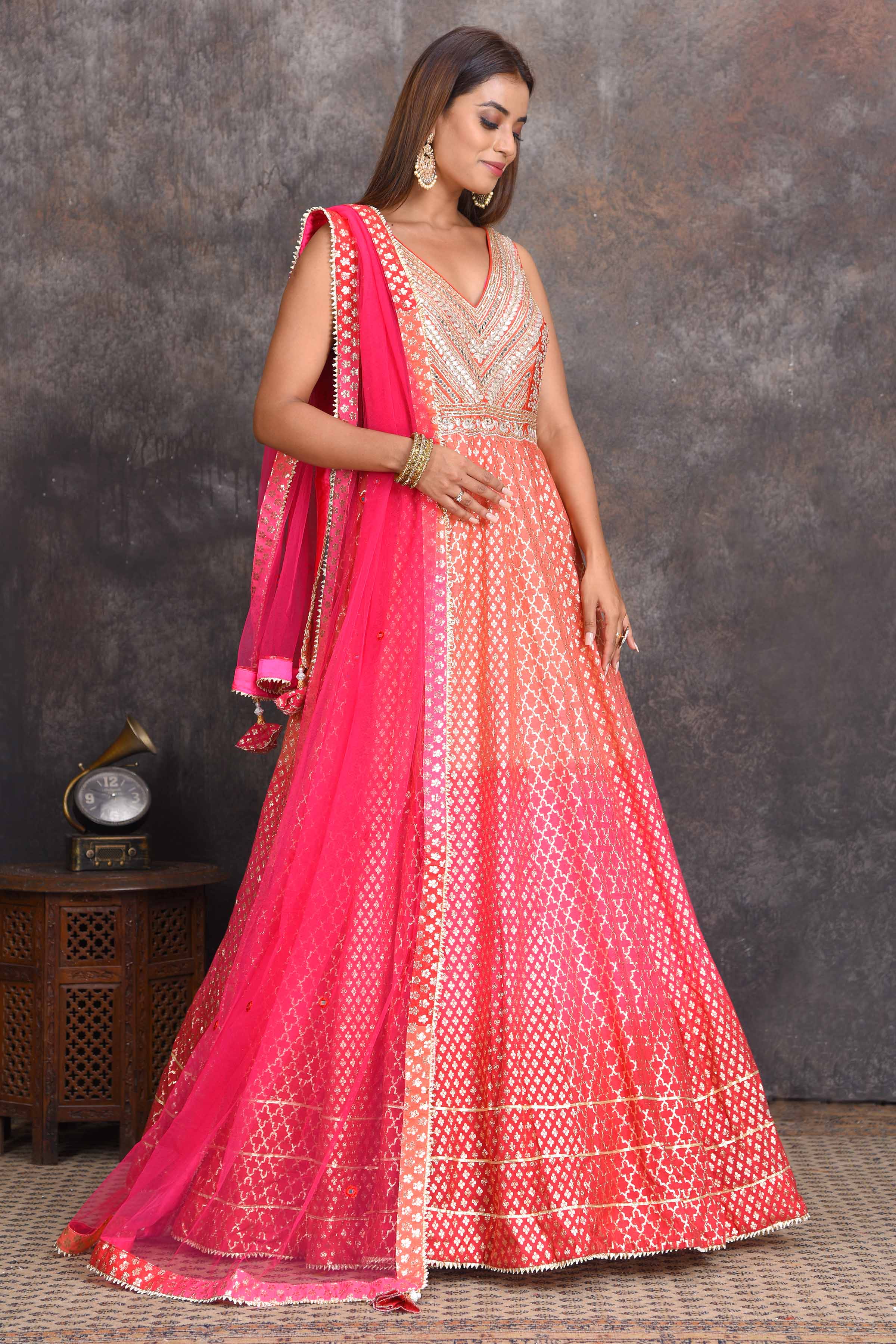 Shop beautiful peach and pink floorlength chanderi Banarasi Anarkali suit online in USA. Set a style statement on special occasions in exquisite designer lehengas, Anarkali suits, sharara suits, salwar suits, Indowestern outfits from Pure Elegance Indian fashion store in USA.-side