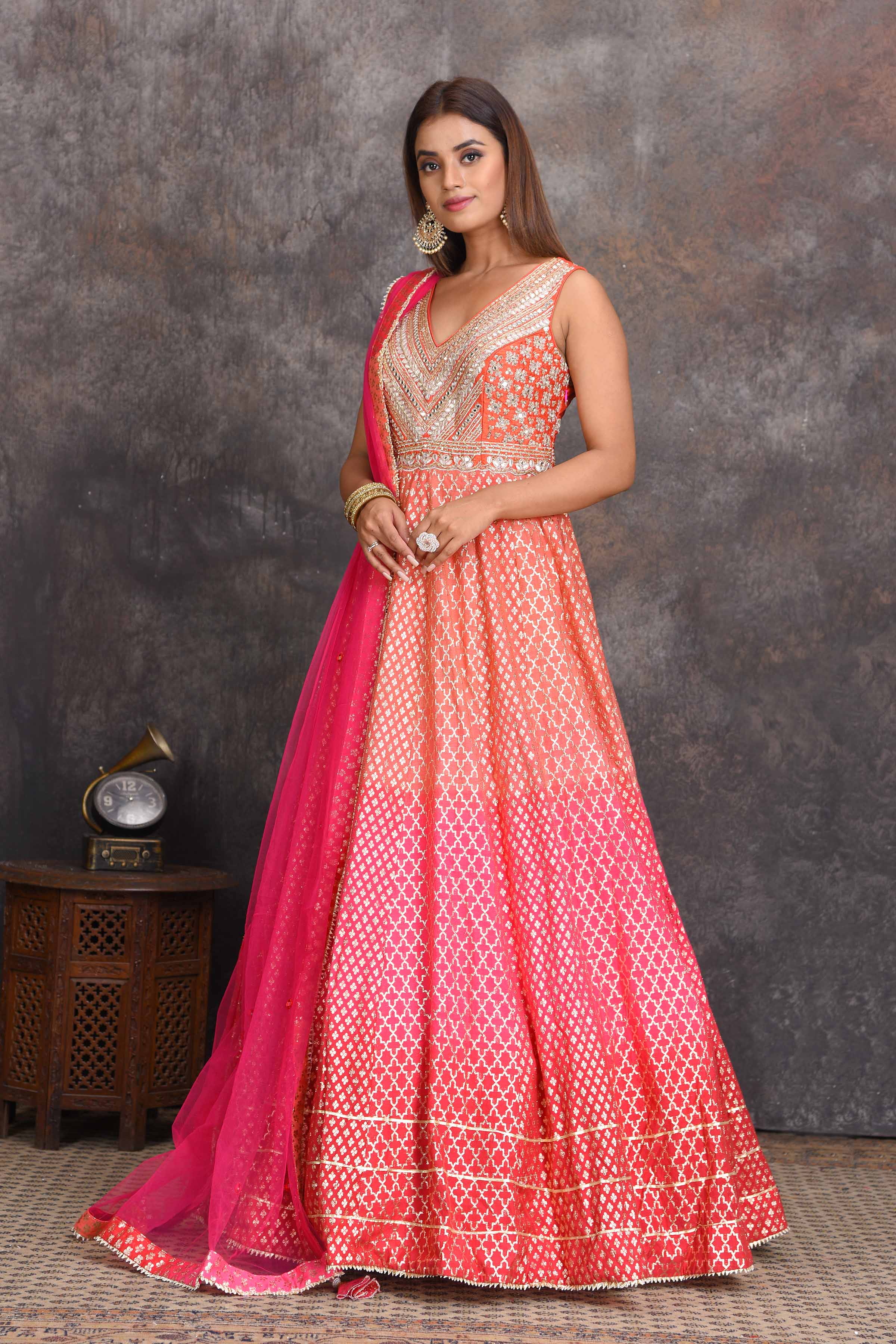 Shop beautiful peach and pink floorlength chanderi Banarasi Anarkali suit online in USA. Set a style statement on special occasions in exquisite designer lehengas, Anarkali suits, sharara suits, salwar suits, Indowestern outfits from Pure Elegance Indian fashion store in USA.-suit