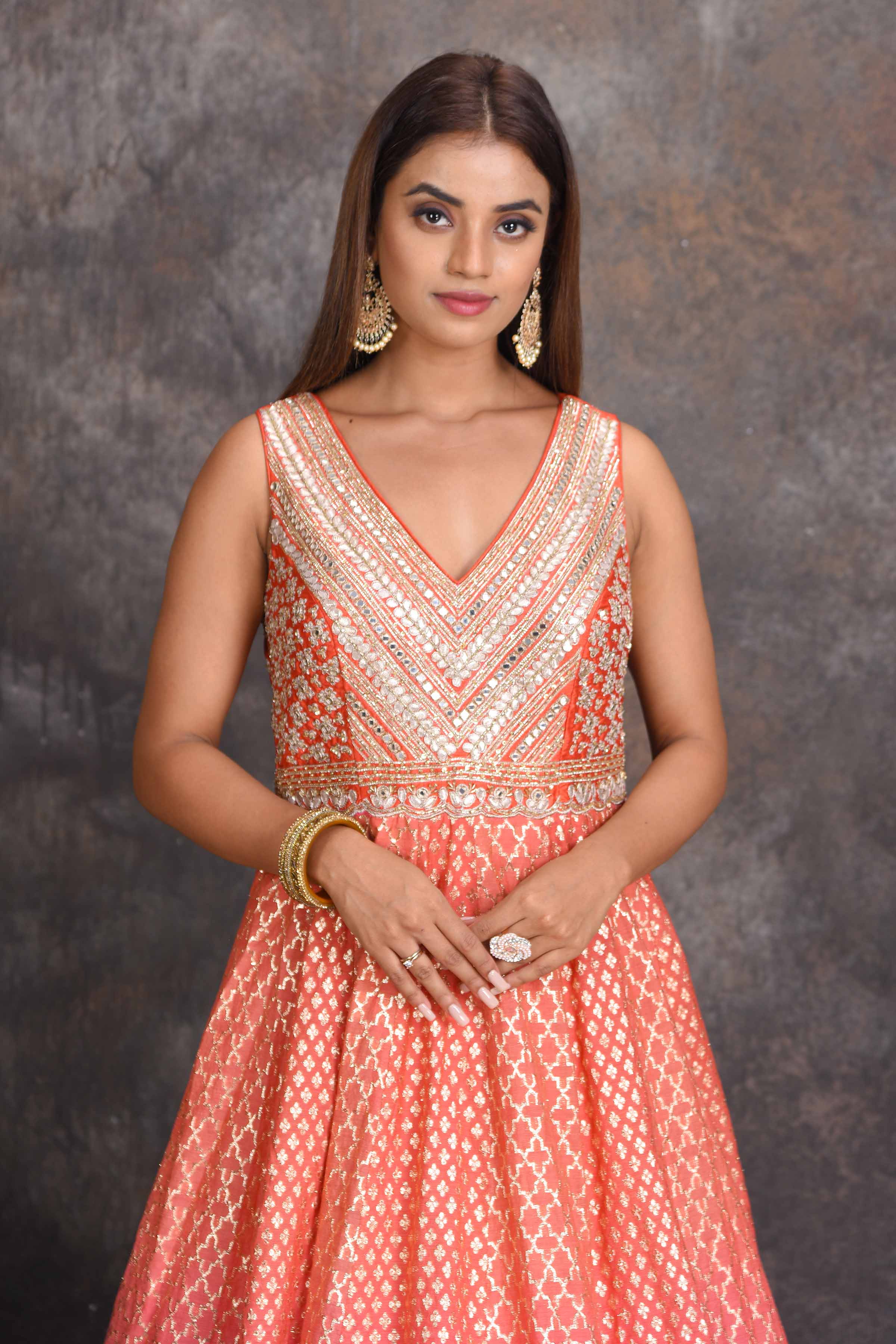 Shop beautiful peach and pink floorlength chanderi Banarasi Anarkali suit online in USA. Set a style statement on special occasions in exquisite designer lehengas, Anarkali suits, sharara suits, salwar suits, Indowestern outfits from Pure Elegance Indian fashion store in USA.-closeup
