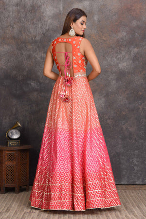 Shop beautiful peach and pink floorlength chanderi Banarasi Anarkali suit online in USA. Set a style statement on special occasions in exquisite designer lehengas, Anarkali suits, sharara suits, salwar suits, Indowestern outfits from Pure Elegance Indian fashion store in USA.-back