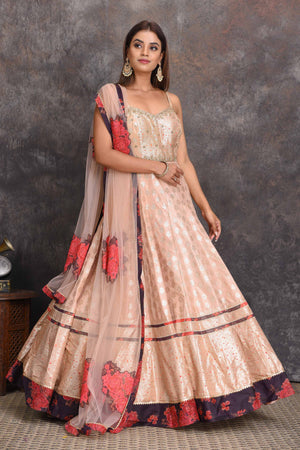 Buy beautiful cream chanderi Banarasi Anarkali online in USA with floral border. Set a style statement on special occasions in exquisite designer lehengas, Anarkali suits, sharara suits, salwar suits, Indowestern outfits from Pure Elegance Indian fashion store in USA.-front
