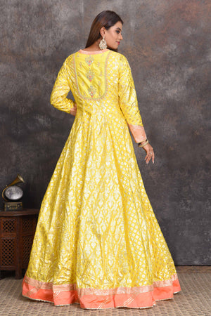 Buy bright yellow chanderi Banarasi Anarkali online in USA with peach dupatta. Set a style statement on special occasions in exquisite designer lehengas, Anarkali suits, sharara suits, salwar suits, Indowestern outfits from Pure Elegance Indian fashion store in USA.-back