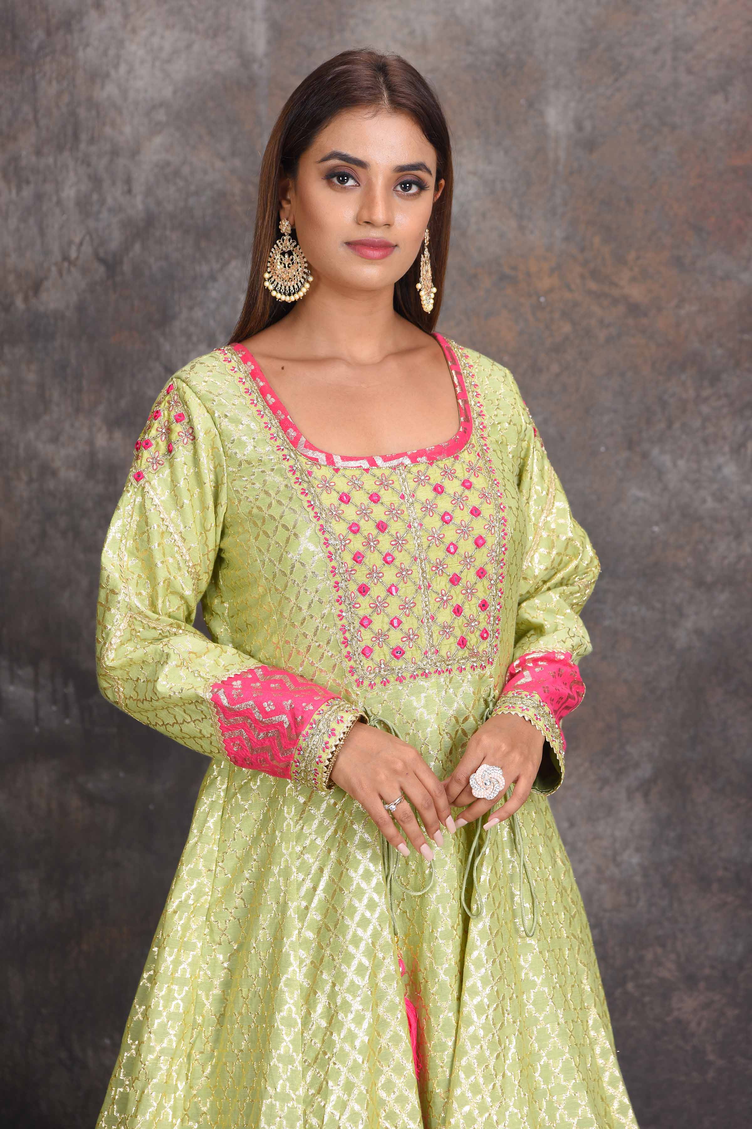 Shop pista green chanderi Banarasi Anarkali online in USA with pink dupatta. Set a style statement on special occasions in exquisite designer lehengas, Anarkali suits, sharara suits, salwar suits, Indowestern outfits from Pure Elegance Indian fashion store in USA.-closeup
