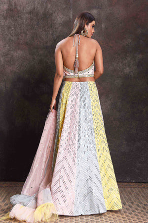 Buy beautiful multicolor pastel mirror work lehenga online in USA with ruffle dupatta. Look your ethnic best on festive occasions with latest designer sarees, pure silk sarees, Kanchipuram silk sarees, designer dresses, Anarkali suits, gown, embroidered sarees from Pure Elegance Indian fashion store in USA.-back