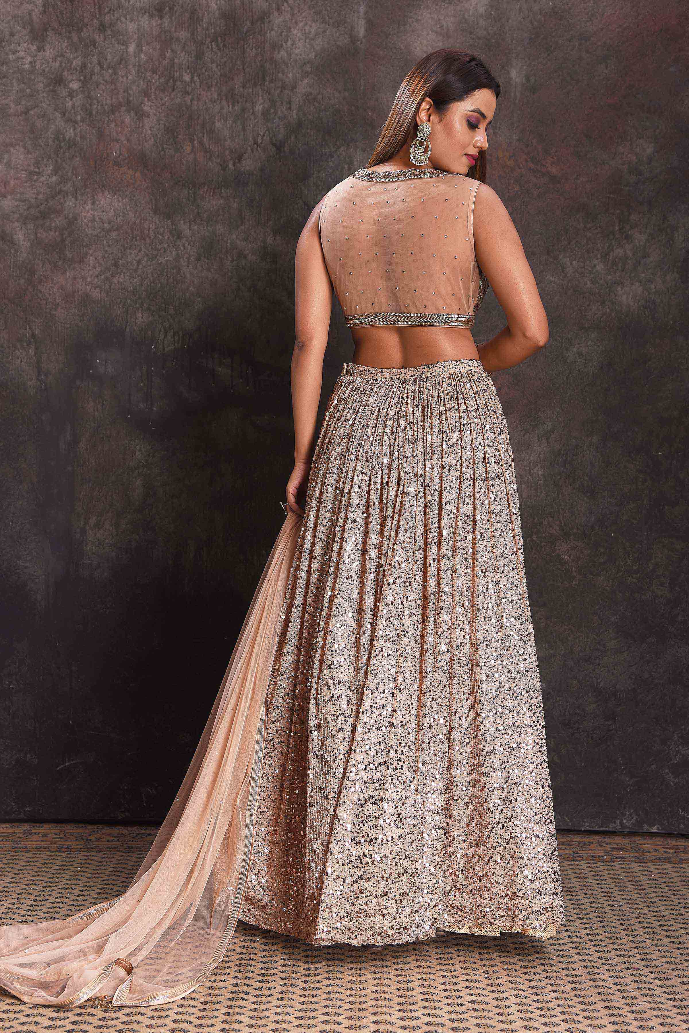 Shop beautiful beige sequin work cocktail lehenga online in USA with dupatta. Look your ethnic best on festive occasions with latest designer sarees, pure silk sarees, Kanchipuram silk sarees, designer dresses, Anarkali suits, gown, embroidered sarees from Pure Elegance Indian fashion store in USA.-back