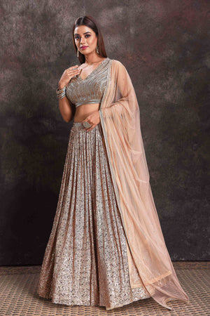 Shop beautiful beige sequin work cocktail lehenga online in USA with dupatta. Look your ethnic best on festive occasions with latest designer sarees, pure silk sarees, Kanchipuram silk sarees, designer dresses, Anarkali suits, gown, embroidered sarees from Pure Elegance Indian fashion store in USA.-side
