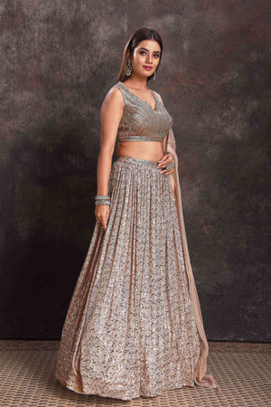 Shop beautiful beige sequin work cocktail lehenga online in USA with dupatta. Look your ethnic best on festive occasions with latest designer sarees, pure silk sarees, Kanchipuram silk sarees, designer dresses, Anarkali suits, gown, embroidered sarees from Pure Elegance Indian fashion store in USA.-right