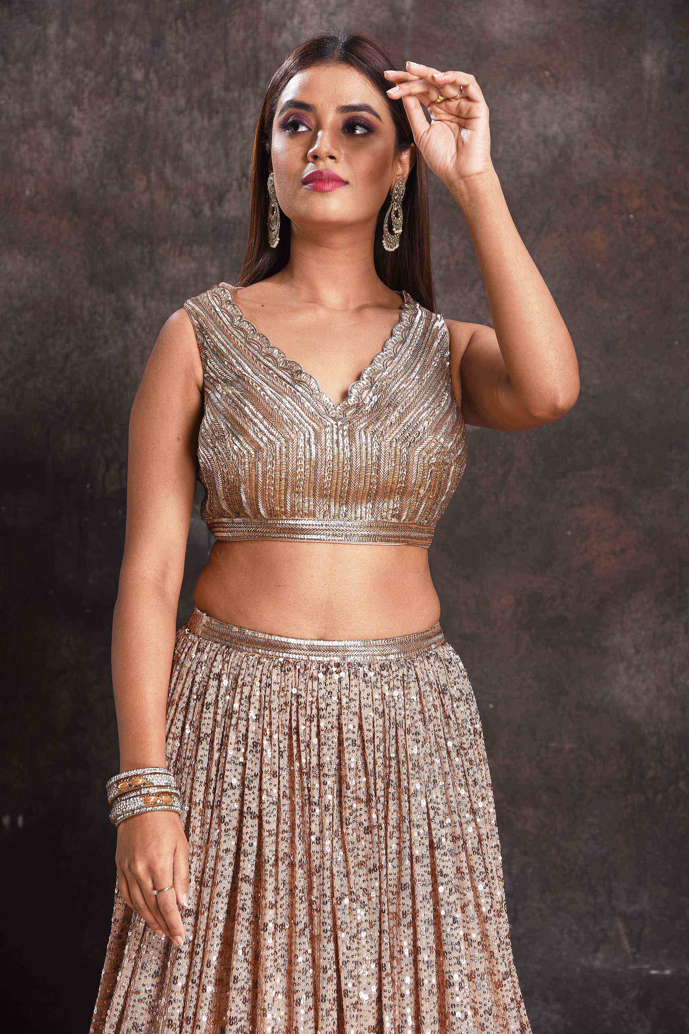 Shop beautiful beige sequin work cocktail lehenga online in USA with dupatta. Look your ethnic best on festive occasions with latest designer sarees, pure silk sarees, Kanchipuram silk sarees, designer dresses, Anarkali suits, gown, embroidered sarees from Pure Elegance Indian fashion store in USA.-closeup