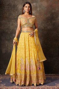 Buy mango yellow embroidered off-shoulder lehenga online in USA. Look stylish at parties and special occasions in beautiful designer sarees, embroidered sarees, handwoven silk, party sarees, lehengas, Anarkali suits from Pure Elegance Indian fashion store in USA.-full view