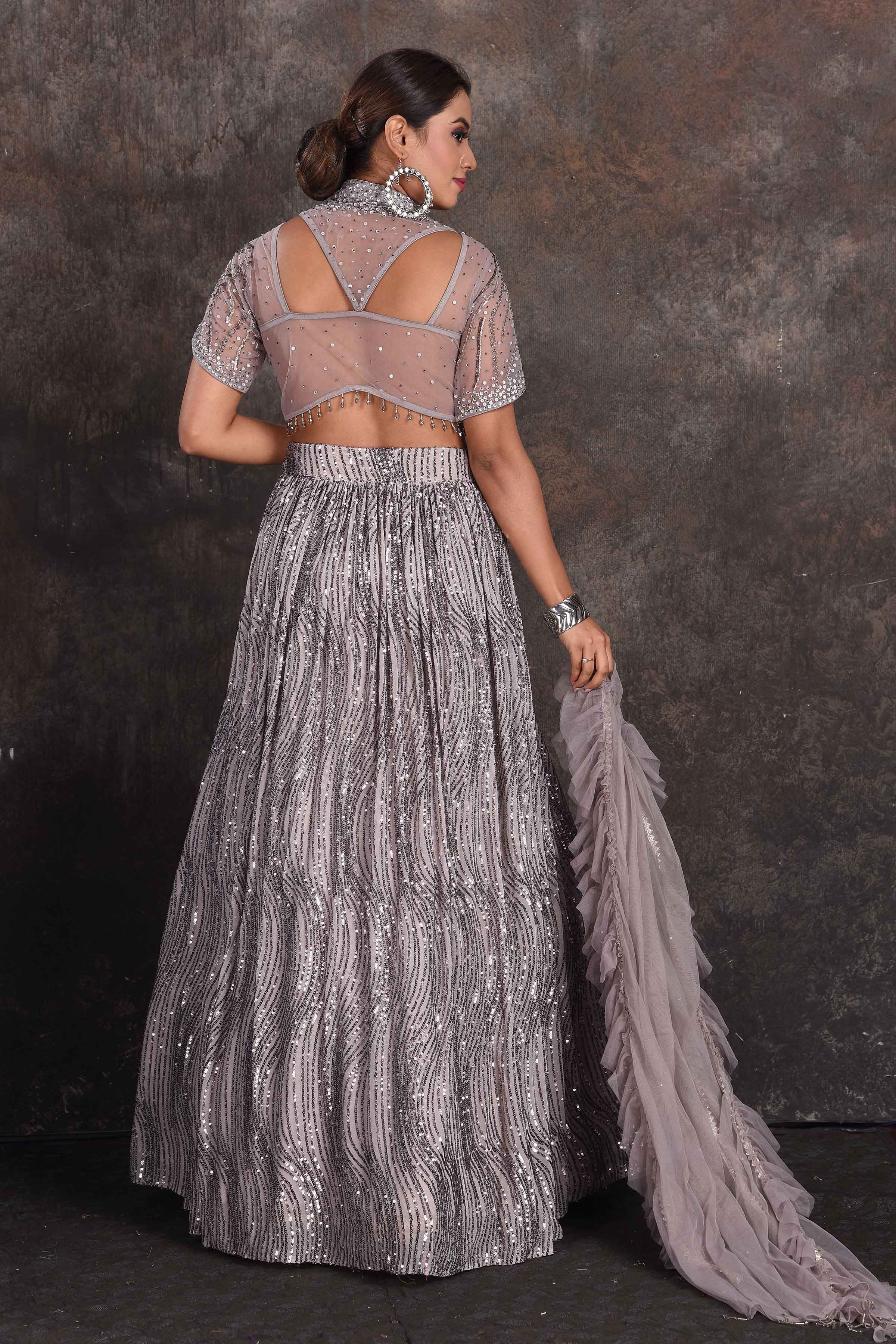 Shop stunning grey embellished designer lehenga online in USA with dupatta. Be the star of the occasion in this stylish designer lehengas, designer gowns, Indowestern dresses, Anarkali suits, sharara suits from Pure Elegance Indian fashion store in USA.-back