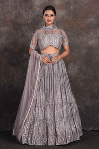 Shop stunning grey embellished designer lehenga online in USA with dupatta. Be the star of the occasion in this stylish designer lehengas, designer gowns, Indowestern dresses, Anarkali suits, sharara suits from Pure Elegance Indian fashion store in USA.-full view