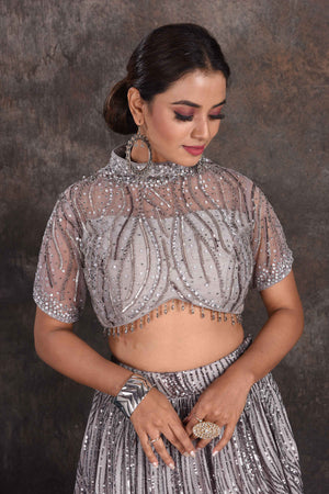 Shop stunning grey embellished designer lehenga online in USA with dupatta. Be the star of the occasion in this stylish designer lehengas, designer gowns, Indowestern dresses, Anarkali suits, sharara suits from Pure Elegance Indian fashion store in USA.-closeup