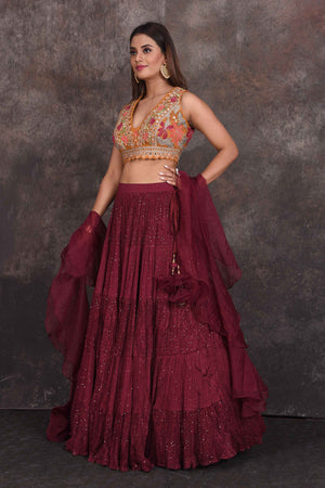 Buy wine color designer lehenga online in USA with multicolor blouse. Be the star of the occasion in this stylish designer lehengas, designer gowns, Indowestern dresses, Anarkali suits, sharara suits from Pure Elegance Indian fashion store in USA.-left