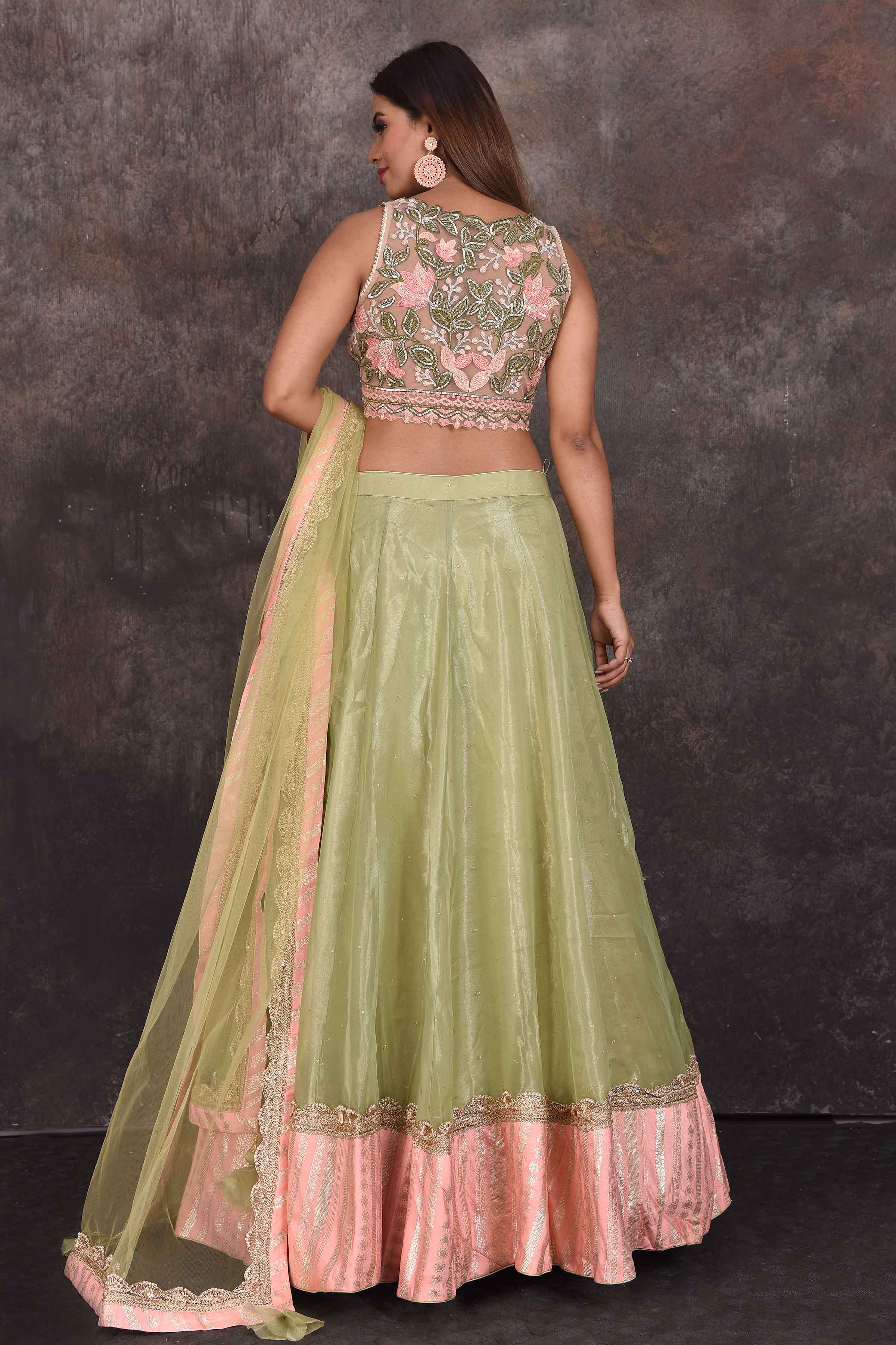 Shop beautiful pista green designer lehenga online in USA with pink blouse. Be the star of the occasion in this stylish designer lehengas, designer gowns, Indowestern dresses, Anarkali suits, sharara suits from Pure Elegance Indian fashion store in USA.-back