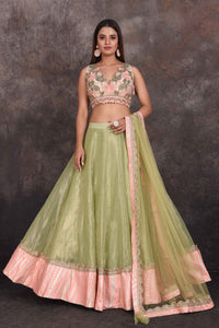 Shop beautiful pista green designer lehenga online in USA with pink blouse. Be the star of the occasion in this stylish designer lehengas, designer gowns, Indowestern dresses, Anarkali suits, sharara suits from Pure Elegance Indian fashion store in USA.-full view