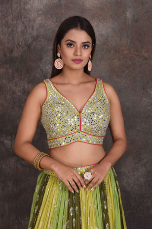 Buy beautiful green and yellow mirror work lehenga online in USA with pink dupatta. Be the star of the occasion in this stylish designer lehengas, designer gowns, Indowestern dresses, Anarkali suits, sharara suits from Pure Elegance Indian fashion store in USA.-closeup