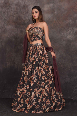 Buy stunning black floral designer lehenga online in USA with corset blouse. Be the star of the occasion in this stylish designer lehengas, designer gowns, Indowestern dresses, Anarkali suits, sharara suits from Pure Elegance Indian fashion store in USA.-side