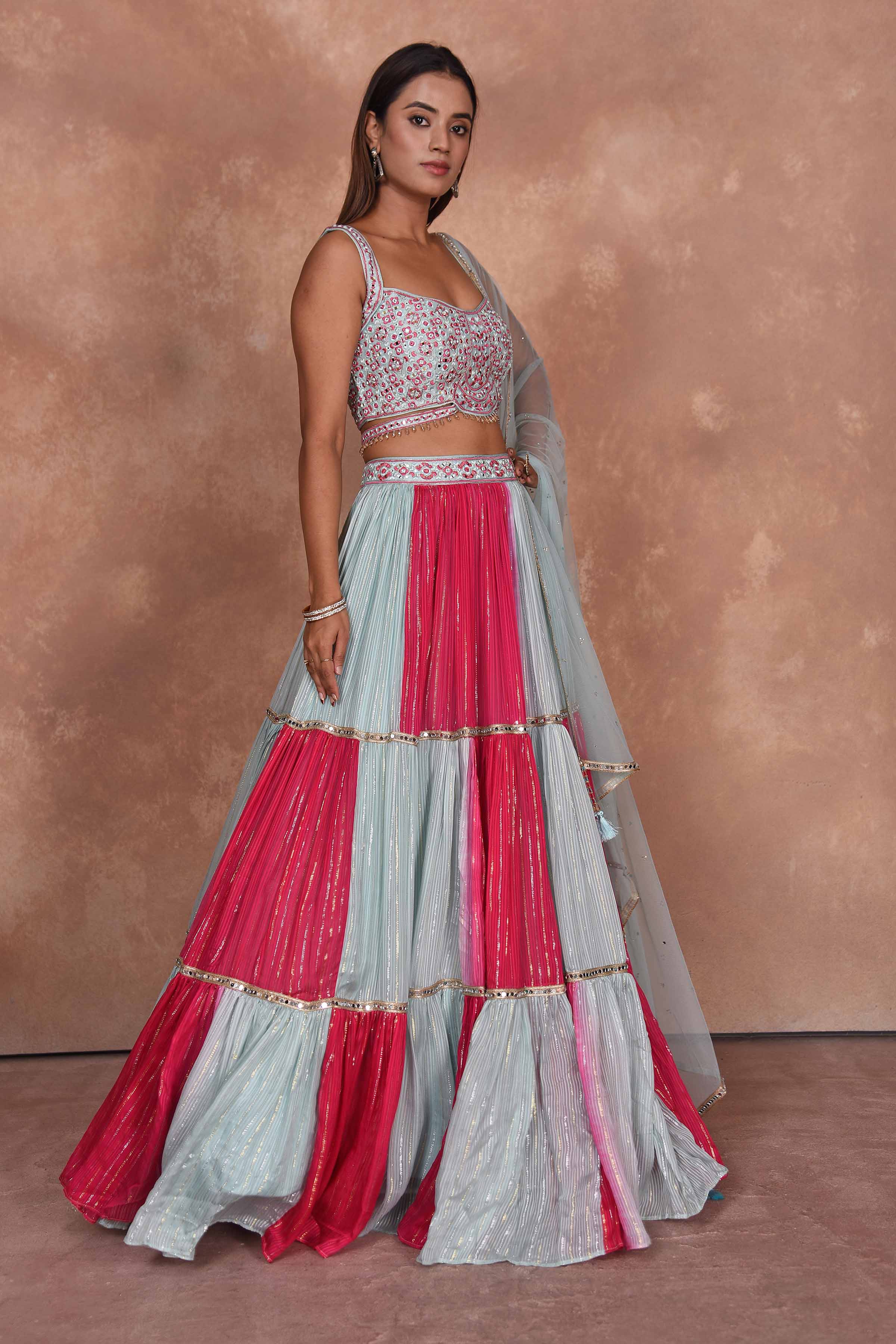 Buy beautiful powder blue and pink designer lehenga online in USA. Dazzle on weddings and special occasions with exquisite Indian designer dresses, embroidered sarees, partywear sarees, Bollywood sarees, handloom sarees, designer lehenga, Anarkali suits from Pure Elegance Indian clothing store in USA.-side