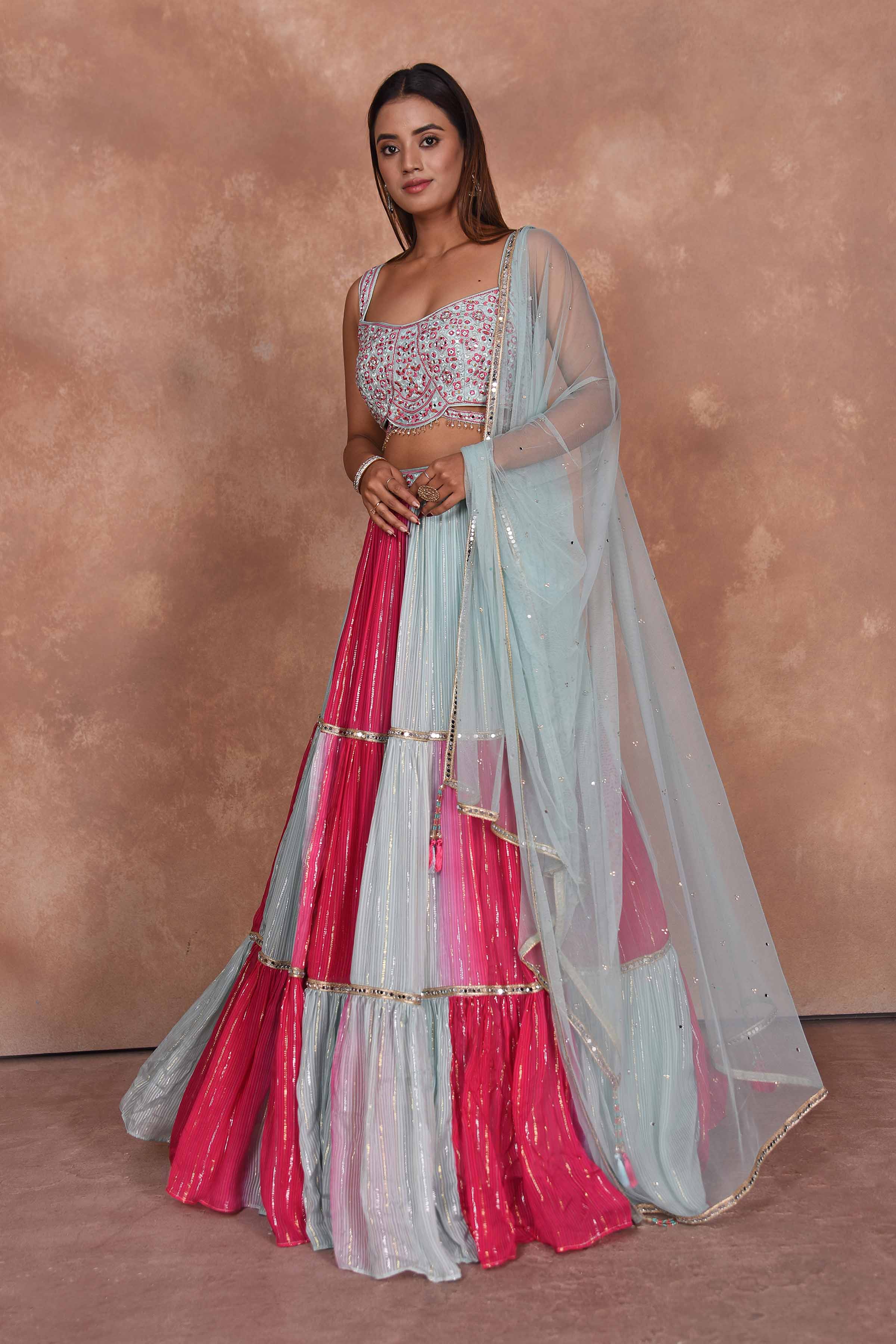 Buy beautiful powder blue and pink designer lehenga online in USA. Dazzle on weddings and special occasions with exquisite Indian designer dresses, embroidered sarees, partywear sarees, Bollywood sarees, handloom sarees, designer lehenga, Anarkali suits from Pure Elegance Indian clothing store in USA.-left
