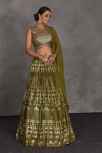 Shop beautiful olive green sequin embroidery designer lehenga online in USA. Flaunt your Indian style on festive occasions in stunning designer lehengas, Anarkali suit, sharara suits, designer gowns, designer sarees, embroidered sarees from Pure Elegance India fashion store in USA. -full view