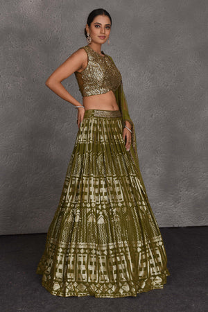 Shop beautiful olive green sequin embroidery designer lehenga online in USA. Flaunt your Indian style on festive occasions in stunning designer lehengas, Anarkali suit, sharara suits, designer gowns, designer sarees, embroidered sarees from Pure Elegance India fashion store in USA. -side