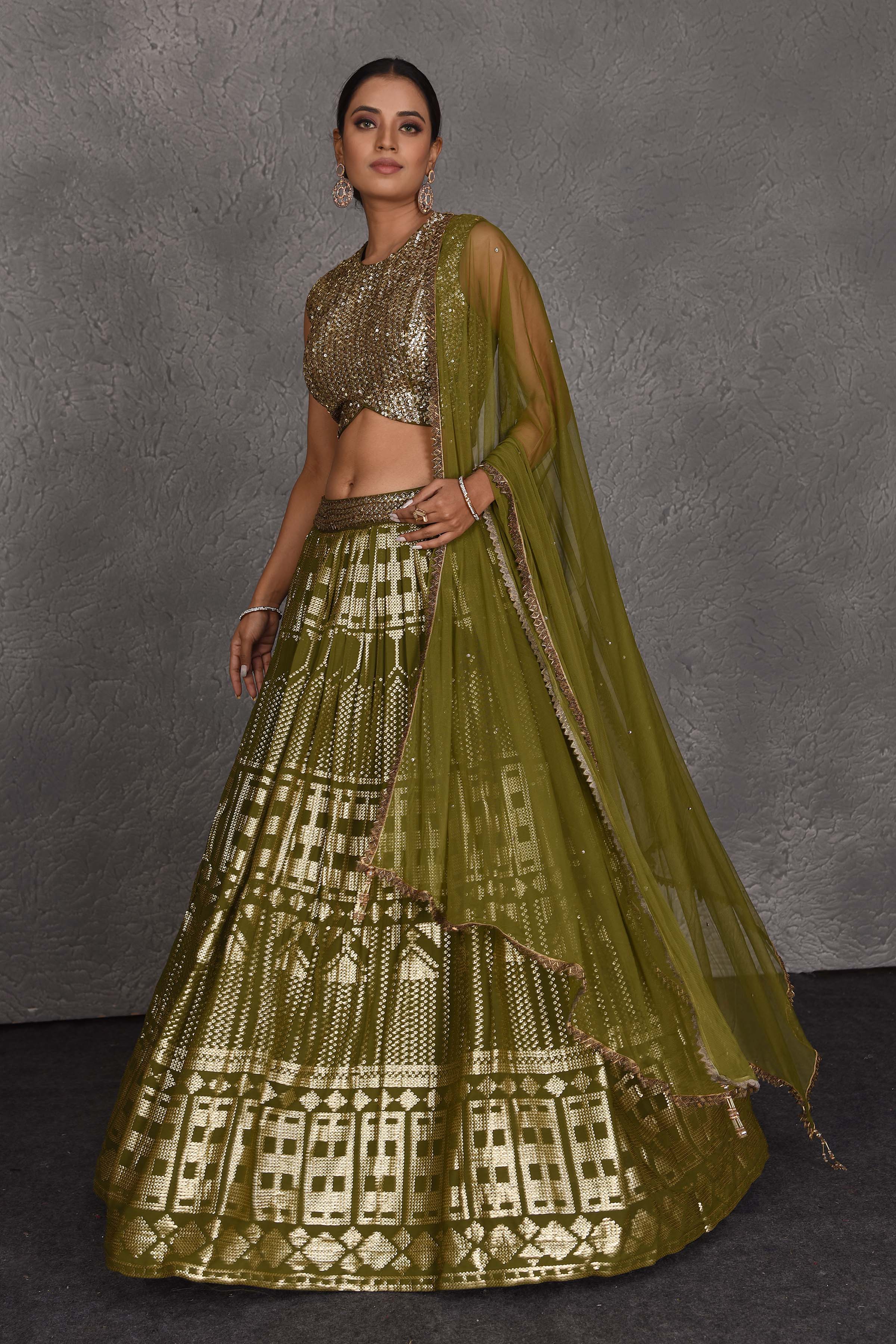Shop beautiful olive green sequin embroidery designer lehenga online in USA. Flaunt your Indian style on festive occasions in stunning designer lehengas, Anarkali suit, sharara suits, designer gowns, designer sarees, embroidered sarees from Pure Elegance India fashion store in USA. -lehenga