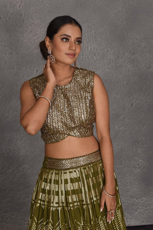 Shop beautiful olive green sequin embroidery designer lehenga online in USA. Flaunt your Indian style on festive occasions in stunning designer lehengas, Anarkali suit, sharara suits, designer gowns, designer sarees, embroidered sarees from Pure Elegance India fashion store in USA. -closeup