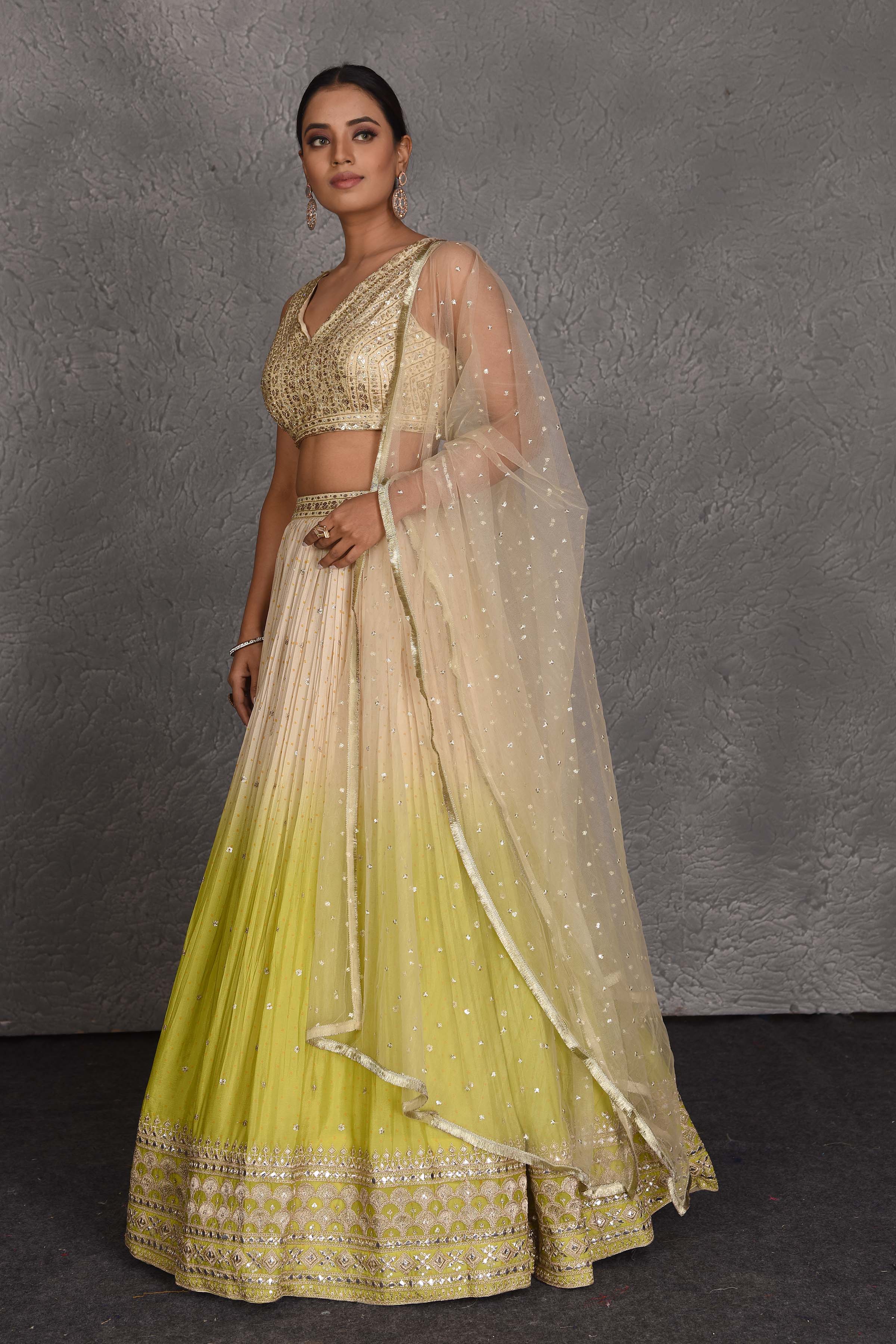 Buy cream and green sequin embroidery lehenga online in USA with dupatta. Flaunt your Indian style on festive occasions in stunning designer lehengas, Anarkali suit, sharara suits, designer gowns, designer sarees, embroidered sarees from Pure Elegance India fashion store in USA. -side