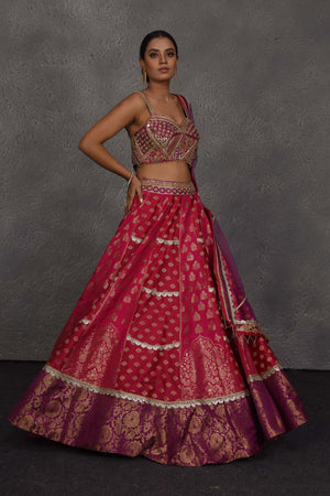 Buy pink and purple Banarasi embroidered lehenga online in USA with dupatta. Flaunt your Indian style on festive occasions in stunning designer lehengas, Anarkali suit, sharara suits, designer gowns, designer sarees, embroidered sarees from Pure Elegance India fashion store in USA. -right