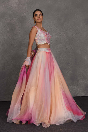 Buy stunning peach and pink embroidered designer lehenga online in USA with dupatta. Flaunt your Indian style on festive occasions in stunning designer lehengas, Anarkali suit, sharara suits, designer gowns, designer sarees, embroidered sarees from Pure Elegance India fashion store in USA. -side