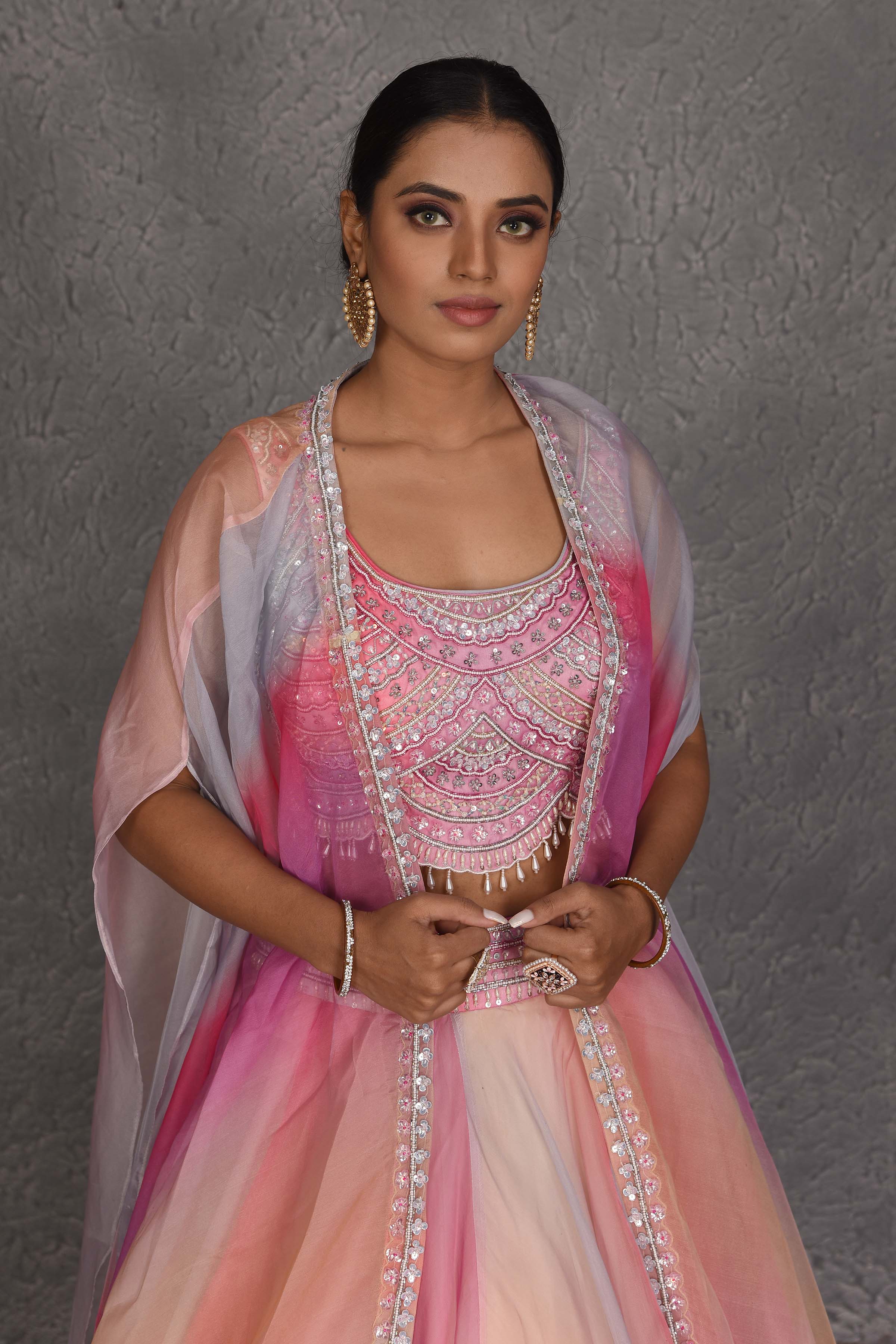 Buy stunning peach and pink embroidered designer lehenga online in USA with dupatta. Flaunt your Indian style on festive occasions in stunning designer lehengas, Anarkali suit, sharara suits, designer gowns, designer sarees, embroidered sarees from Pure Elegance India fashion store in USA. -closeup