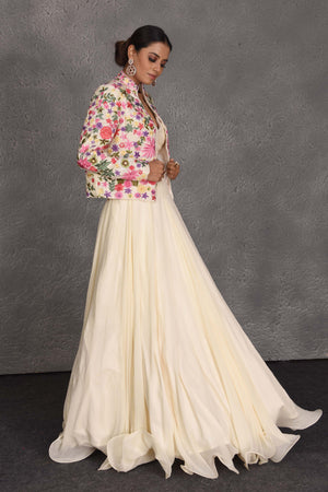 Shop beautiful cream skirt set online in USA with embroidered jacket. Flaunt your Indian style on festive occasions in stunning designer lehengas, Anarkali suit, sharara suits, designer gowns, designer sarees, embroidered sarees from Pure Elegance India fashion store in USA. -side