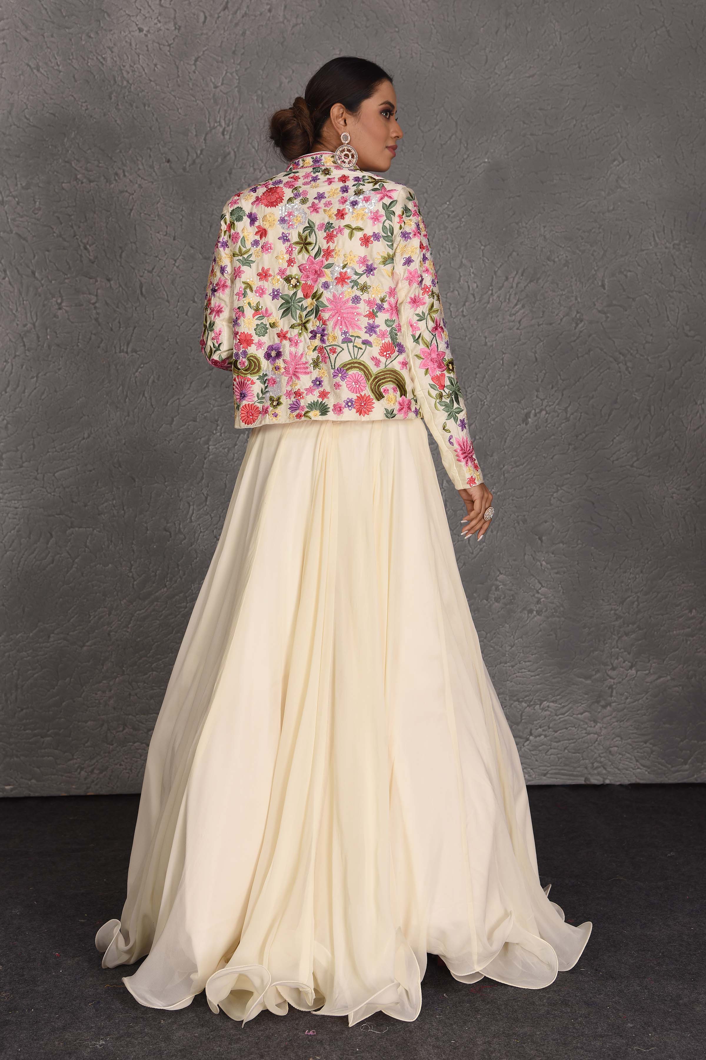 Shop beautiful cream skirt set online in USA with embroidered jacket. Flaunt your Indian style on festive occasions in stunning designer lehengas, Anarkali suit, sharara suits, designer gowns, designer sarees, embroidered sarees from Pure Elegance India fashion store in USA. -back