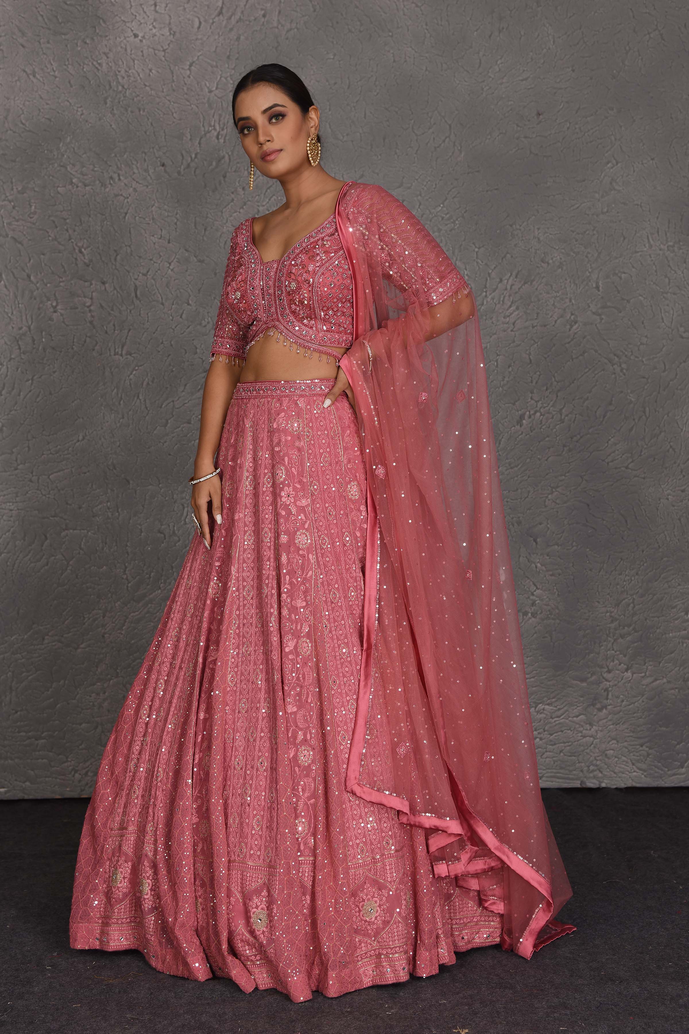 Shop blush pink embroidered designer lehenga online in USA with dupatta. Flaunt your Indian style on festive occasions in stunning designer lehengas, Anarkali suit, sharara suits, designer gowns, designer sarees, embroidered sarees from Pure Elegance India fashion store in USA. -side