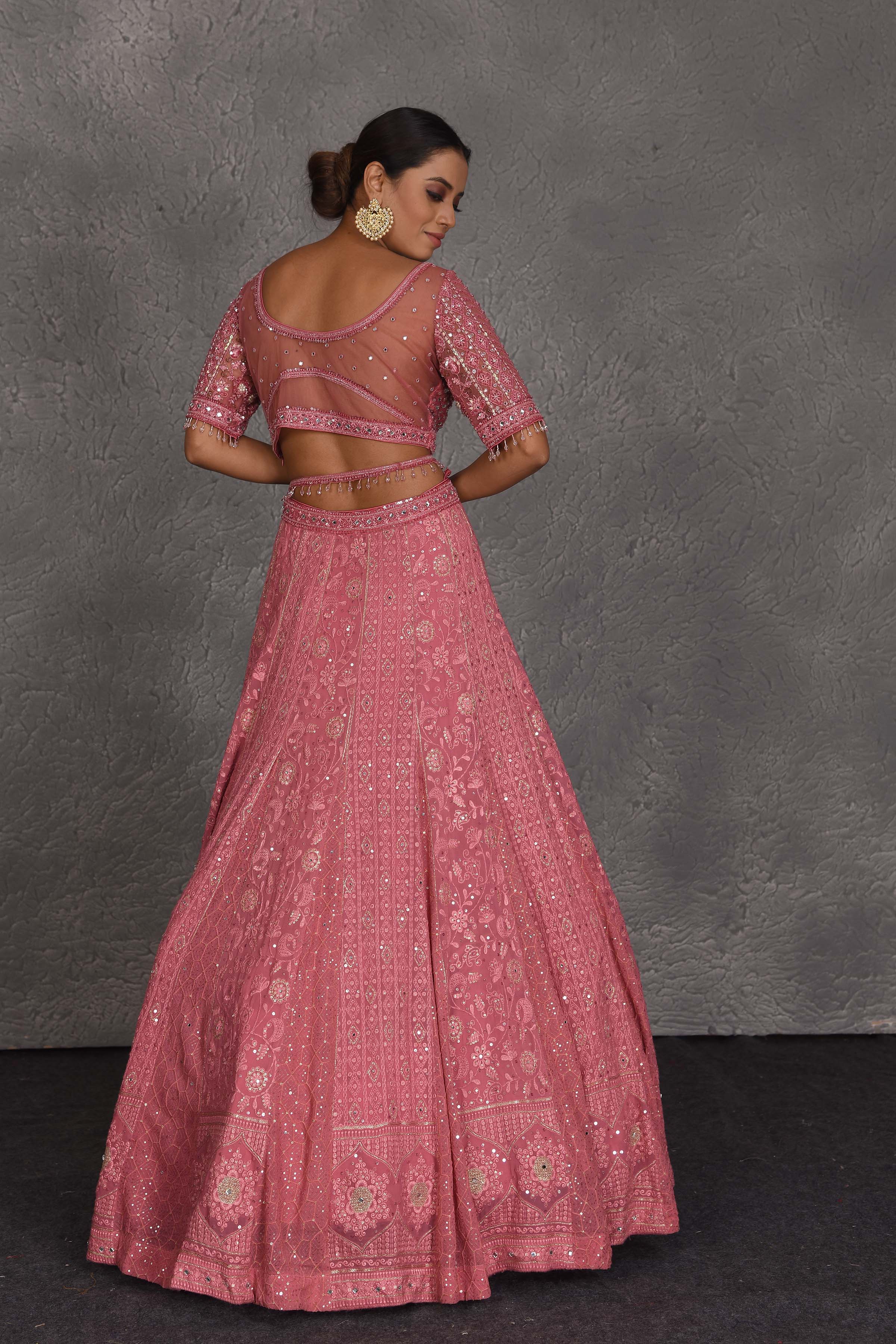Shop blush pink embroidered designer lehenga online in USA with dupatta. Flaunt your Indian style on festive occasions in stunning designer lehengas, Anarkali suit, sharara suits, designer gowns, designer sarees, embroidered sarees from Pure Elegance India fashion store in USA. -back