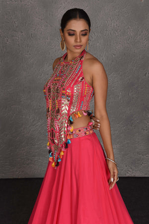 Shop pink boho lehenga online in USA with halter neck blouse. Flaunt your Indian style on festive occasions in stunning designer lehengas, Anarkali suit, sharara suits, designer gowns, designer sarees, embroidered sarees from Pure Elegance India fashion store in USA. -side