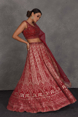 Shop red embroidered designer lehenga online in USA with net dupatta. Flaunt your Indian style on festive occasions in stunning designer lehengas, Anarkali suit, sharara suits, designer gowns, designer sarees, embroidered sarees from Pure Elegance India fashion store in USA. -right