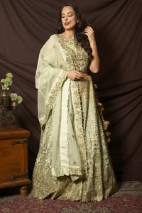 Buy gorgeous dusty green foil print embroidered lehenga online in USA with dupatta. Shine at weddings and special occasions with beautiful Indian designer dresses, gowns, lehengas from Pure Elegance Indian clothing store in USA.-full view