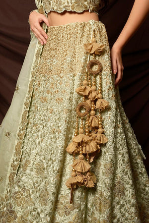 Buy gorgeous dusty green foil print embroidered lehenga online in USA with dupatta. Shine at weddings and special occasions with beautiful Indian designer dresses, gowns, lehengas from Pure Elegance Indian clothing store in USA.-lehenga skirt